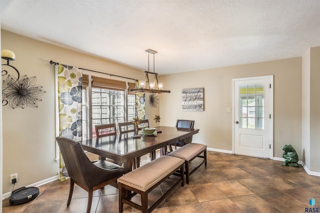 dining area with a textured ceiling