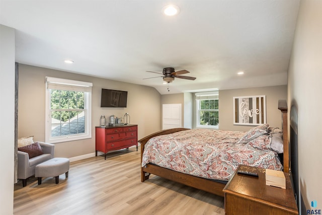 bedroom with light hardwood / wood-style flooring, multiple windows, and ceiling fan