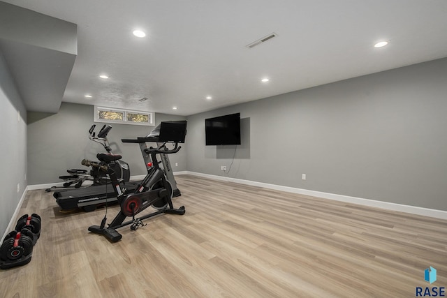 workout area featuring light hardwood / wood-style floors