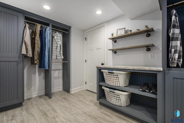 spacious closet featuring light wood-type flooring