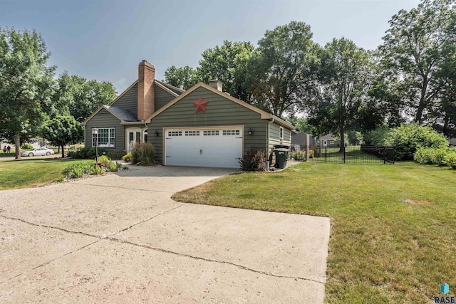 view of front of house featuring a front yard and a garage