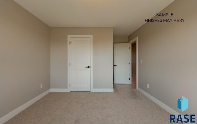 unfurnished bedroom featuring light carpet