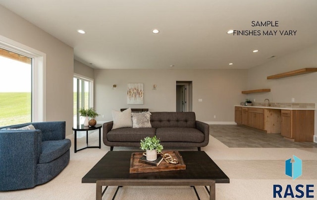 carpeted living room featuring sink