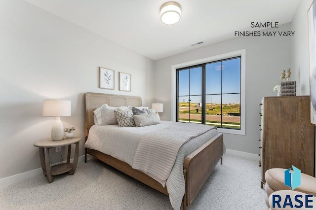 bedroom with baseboards and visible vents