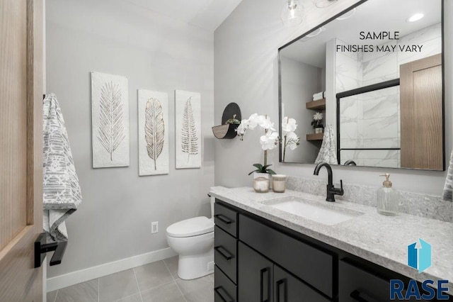 bathroom featuring tile patterned floors, vanity, toilet, and baseboards