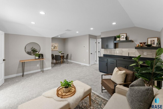 living room featuring recessed lighting, visible vents, light carpet, vaulted ceiling, and baseboards