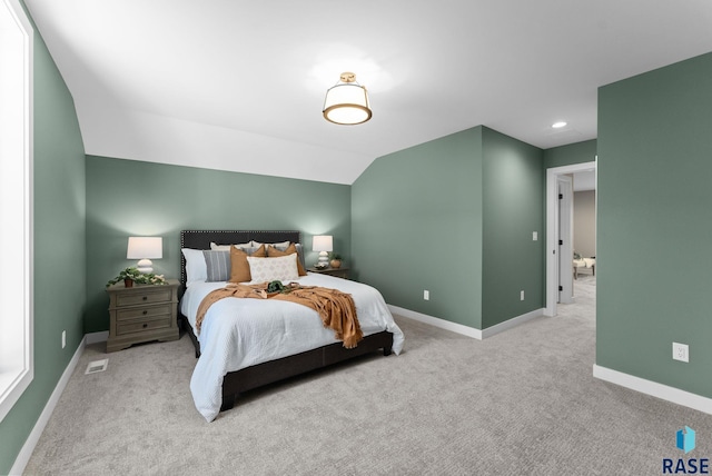 bedroom with visible vents, baseboards, lofted ceiling, carpet, and recessed lighting