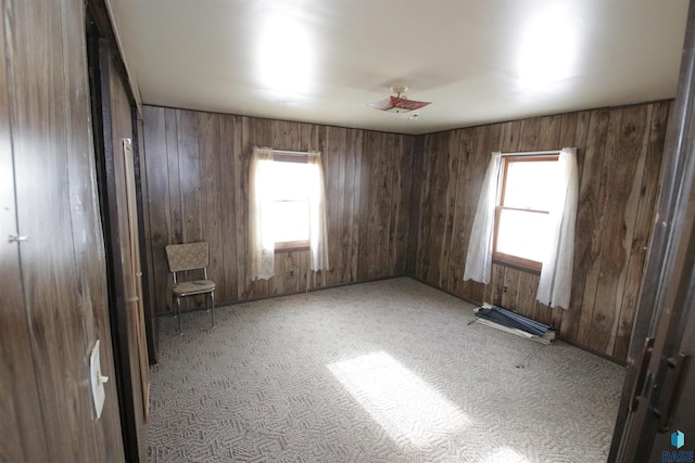 empty room with plenty of natural light and light colored carpet