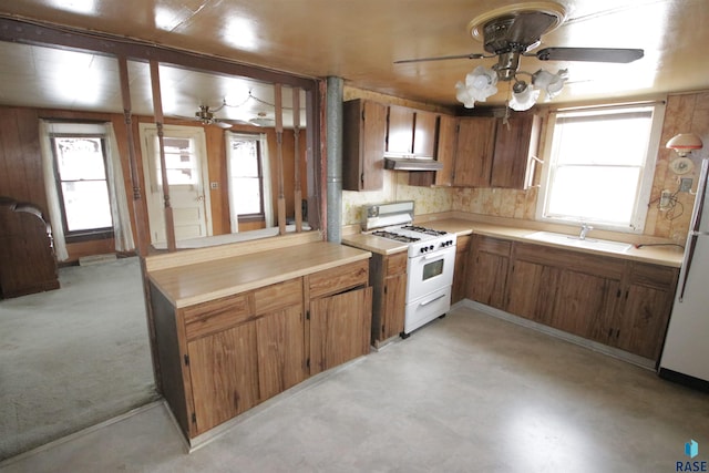 kitchen with white appliances, sink, ceiling fan, decorative backsplash, and extractor fan