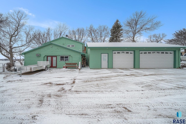 view of front of home featuring french doors and a garage