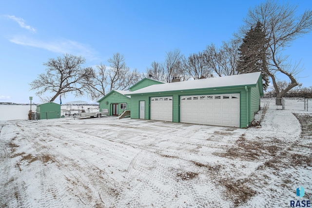 view of snow covered garage