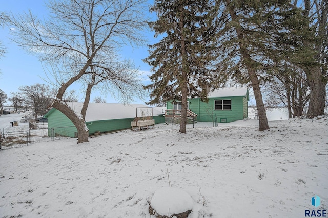 view of snow covered house