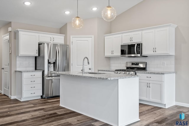 kitchen featuring tasteful backsplash, white cabinetry, sink, and stainless steel appliances