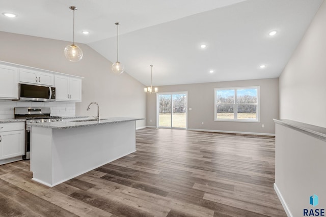 kitchen with white cabinetry, sink, wood-type flooring, and appliances with stainless steel finishes