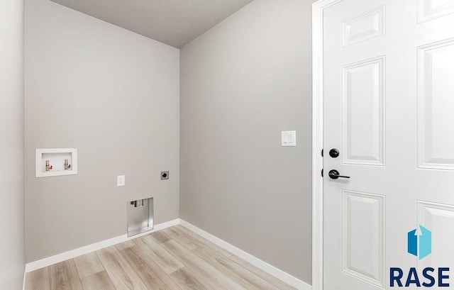 washroom with washer hookup, electric dryer hookup, and light wood-type flooring