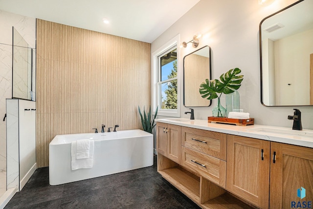 bathroom with a bath and vanity