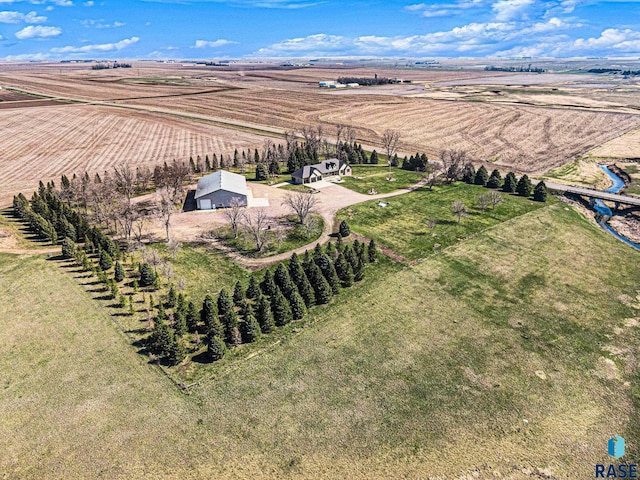 birds eye view of property featuring a rural view