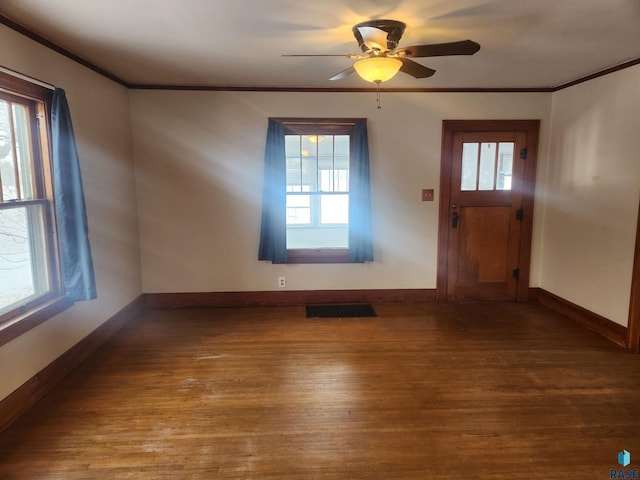 entryway with a wealth of natural light, ceiling fan, crown molding, and hardwood / wood-style flooring