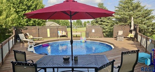 view of pool featuring a wooden deck