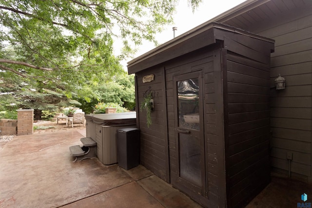 view of outdoor structure featuring a hot tub