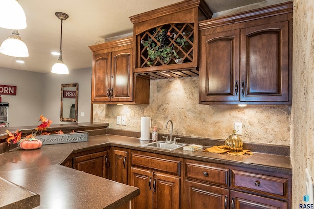 kitchen with sink, decorative backsplash, and decorative light fixtures