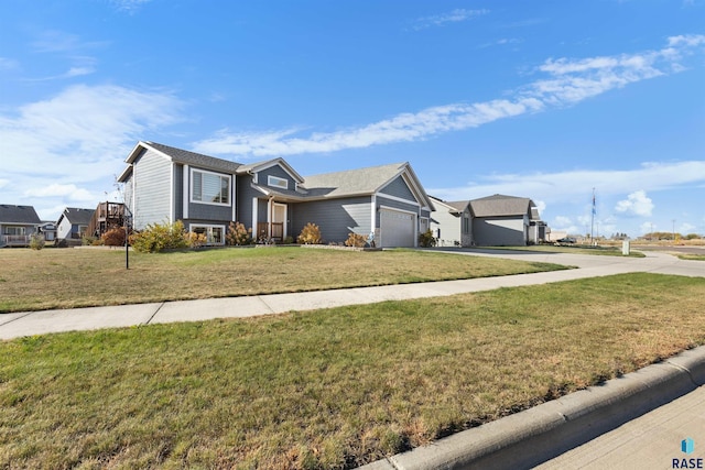 view of front of property with a front lawn and a garage