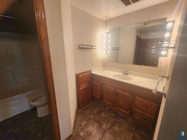 full bathroom featuring bathtub / shower combination, vanity, and toilet