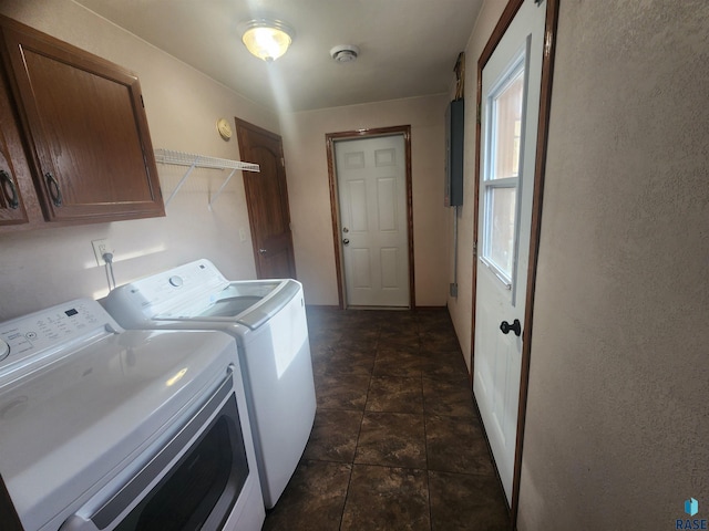 laundry room featuring cabinets and washer and dryer