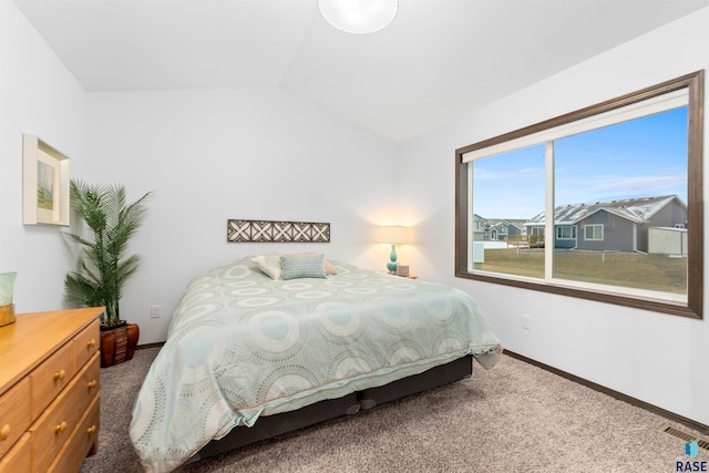 bedroom featuring carpet flooring and lofted ceiling