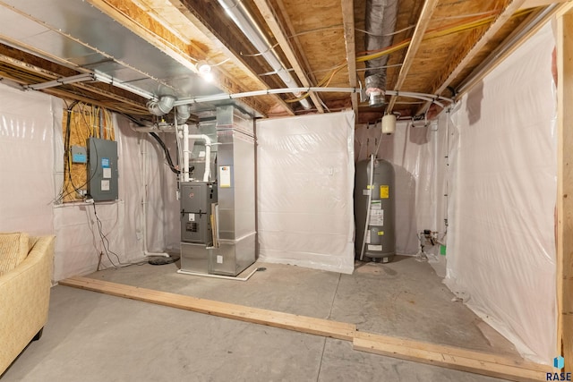 utility room featuring electric panel and water heater