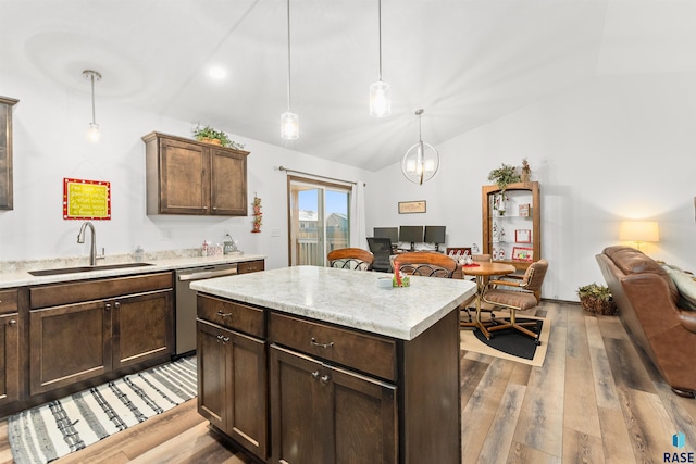 kitchen with dishwasher, a center island, lofted ceiling, sink, and hanging light fixtures