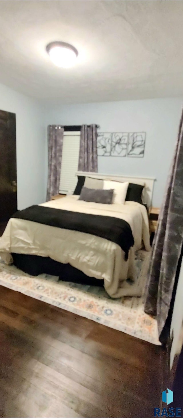 bedroom featuring wood-type flooring