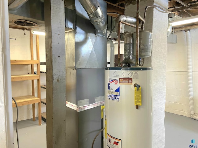 utility room featuring water heater