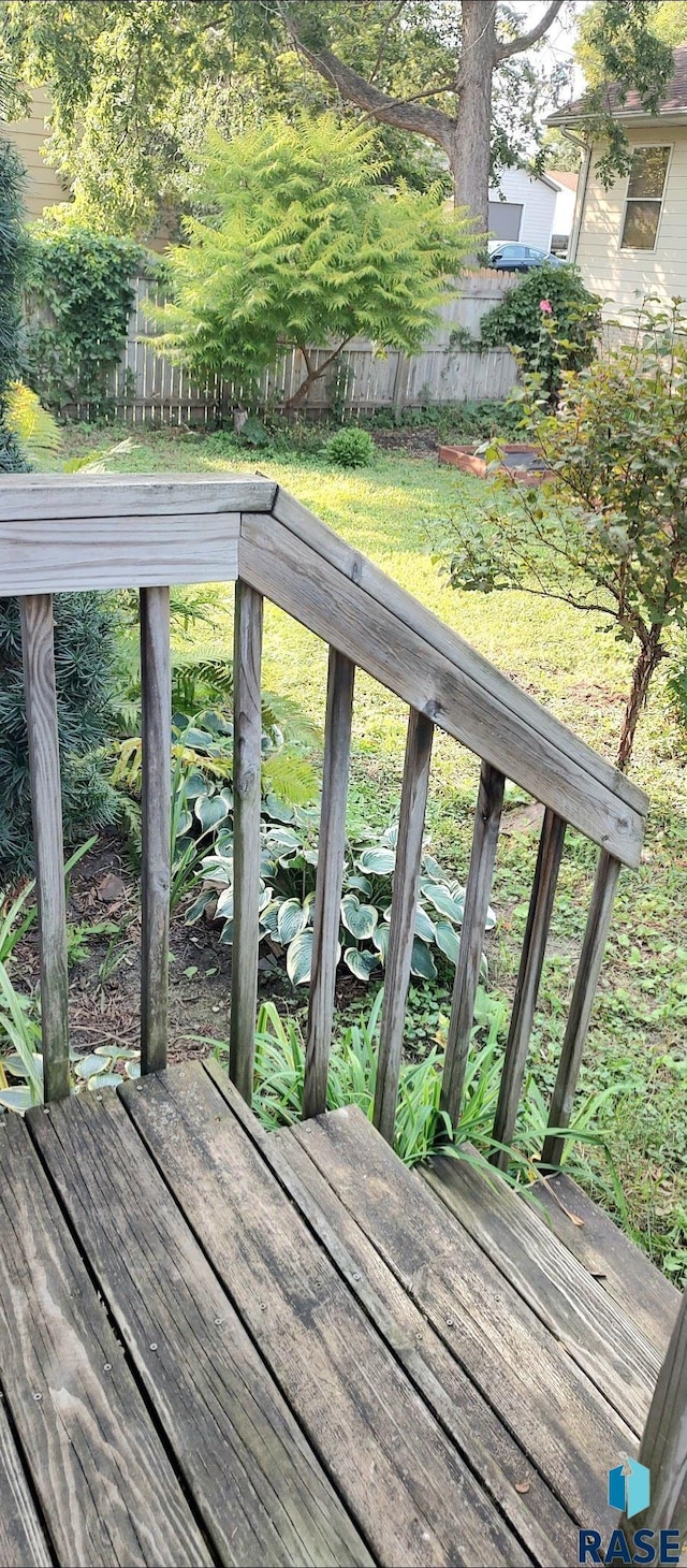 wooden terrace with a yard