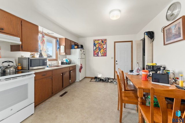 kitchen featuring sink and white appliances