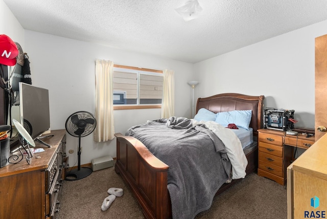 bedroom with light carpet and a textured ceiling