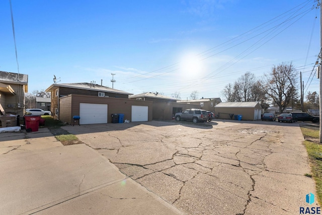 single story home with an outbuilding and a garage