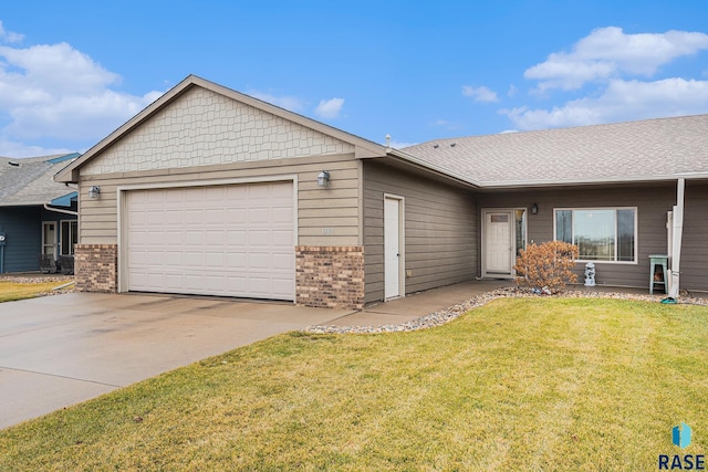 single story home with a garage and a front lawn