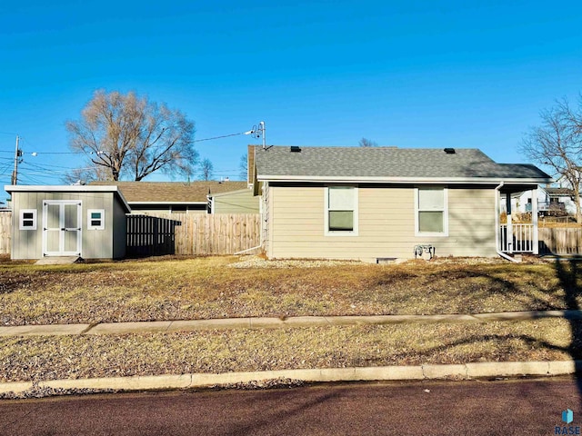 exterior space with a yard and a storage shed