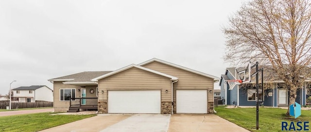 view of front facade with a front yard and a garage