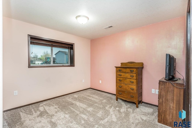 unfurnished bedroom featuring light carpet