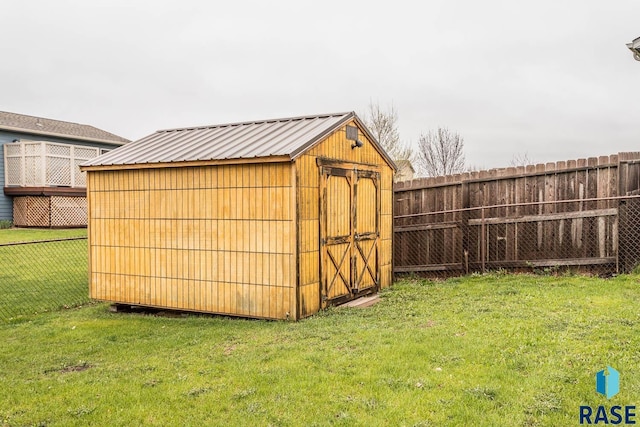 view of outbuilding with a lawn