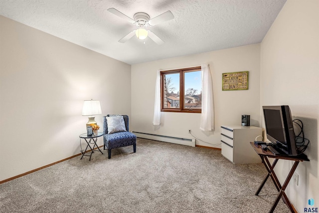 sitting room featuring ceiling fan, carpet, a textured ceiling, and a baseboard heating unit