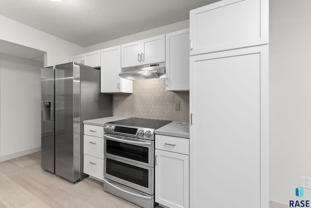 kitchen featuring white cabinets, light hardwood / wood-style flooring, a textured ceiling, appliances with stainless steel finishes, and tasteful backsplash