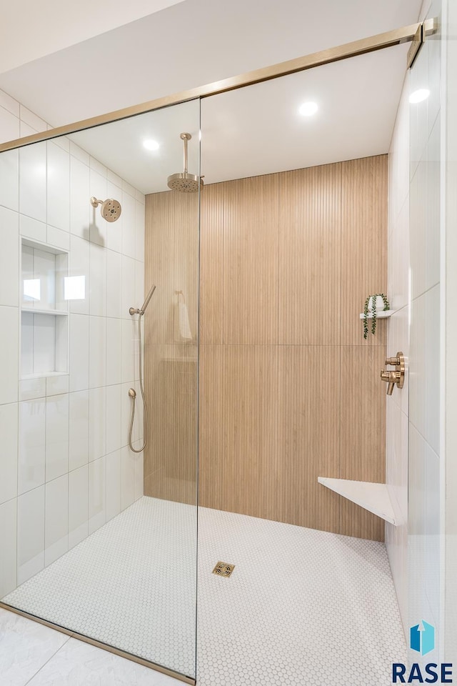 bathroom with tiled shower