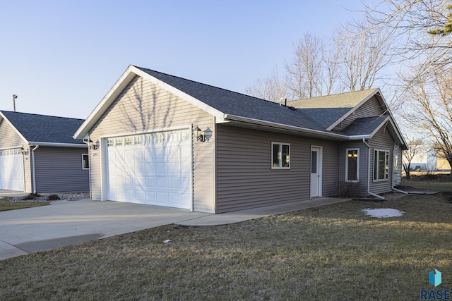 view of front of house with a front yard and a garage