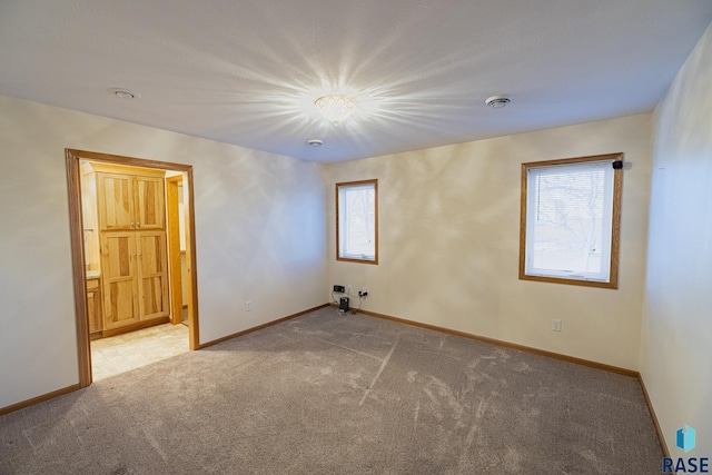 unfurnished room featuring carpet flooring