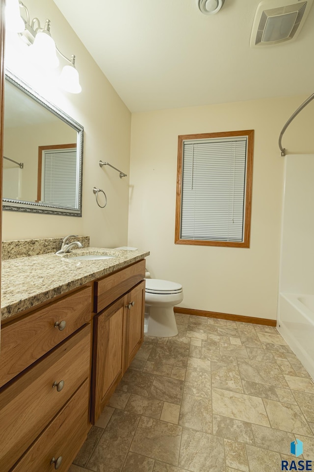 full bathroom with shower / washtub combination, vanity, and toilet