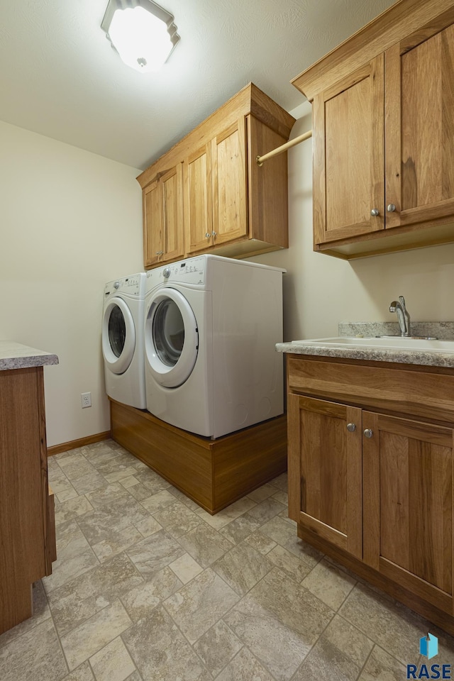 laundry area with cabinets and independent washer and dryer