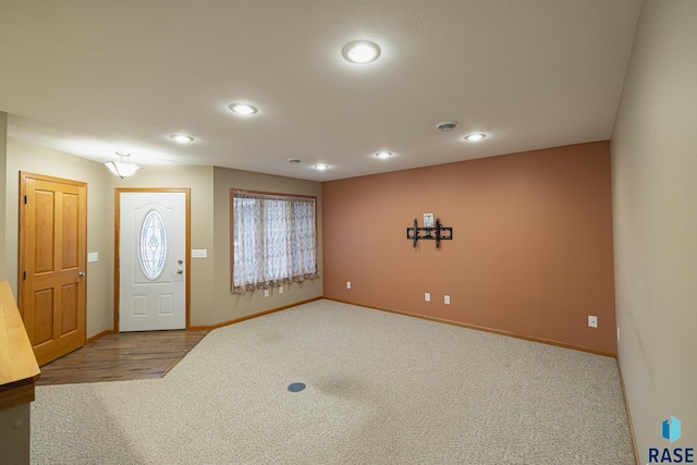 foyer featuring carpet flooring